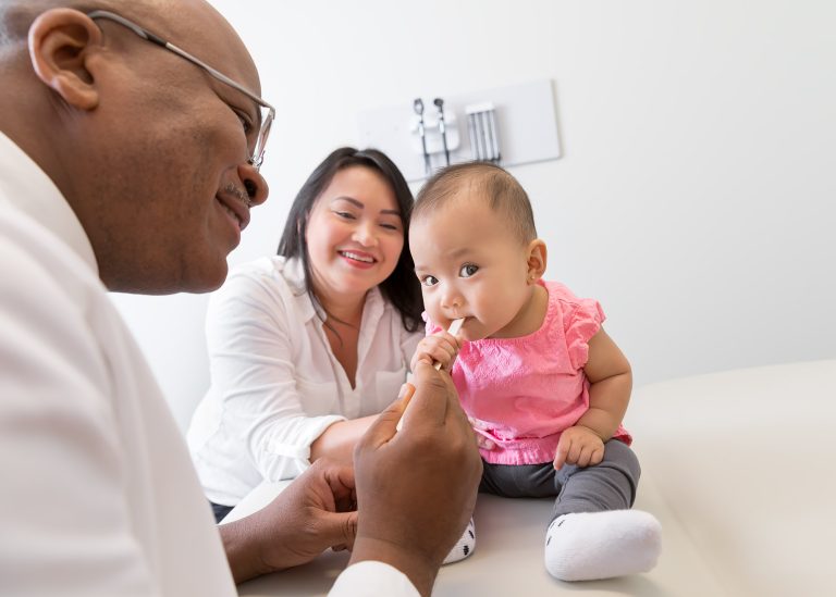 Doctor treating baby in Pediatric Care