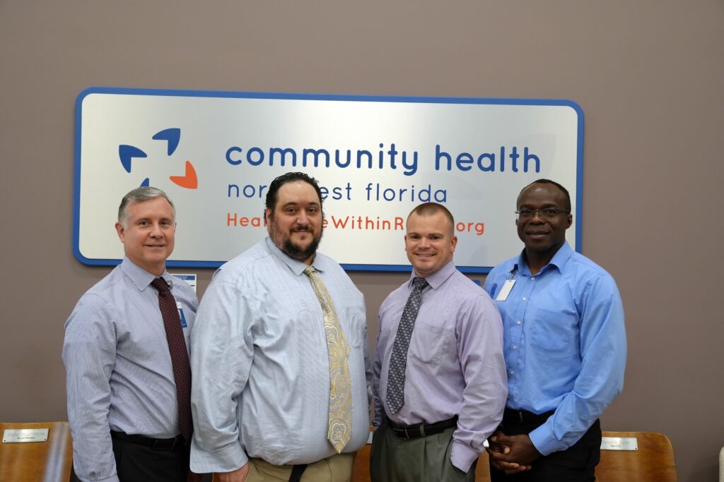 Darrell Miller, Community Health Northwest Florida Chief Pharmacy Officer; Steven Bollen, Community Health Northwest Florida Pharmacy Director; Ryan Pinto, Pharmacy Resident; Arinze Nkemdirim Okere, senior investigator, residency program director and research mentor.