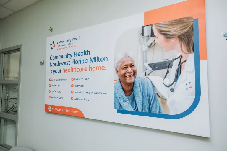 A sign showing services at the Community Health Northwest Florida Milton office.