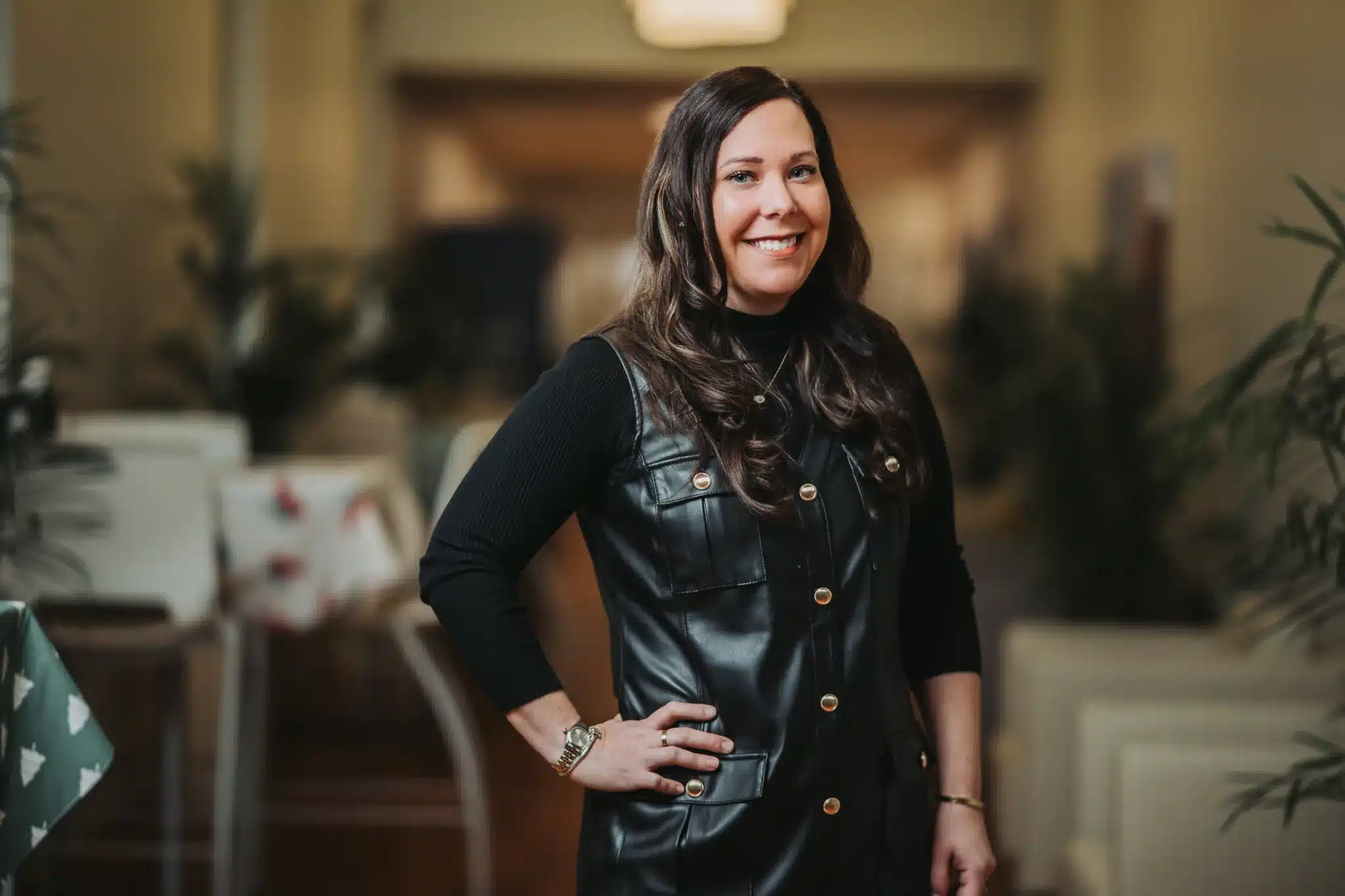 A woman in a black leather dress.