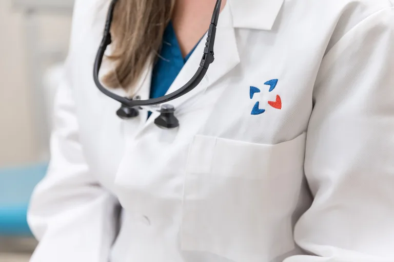 A doctor in a lab coat.