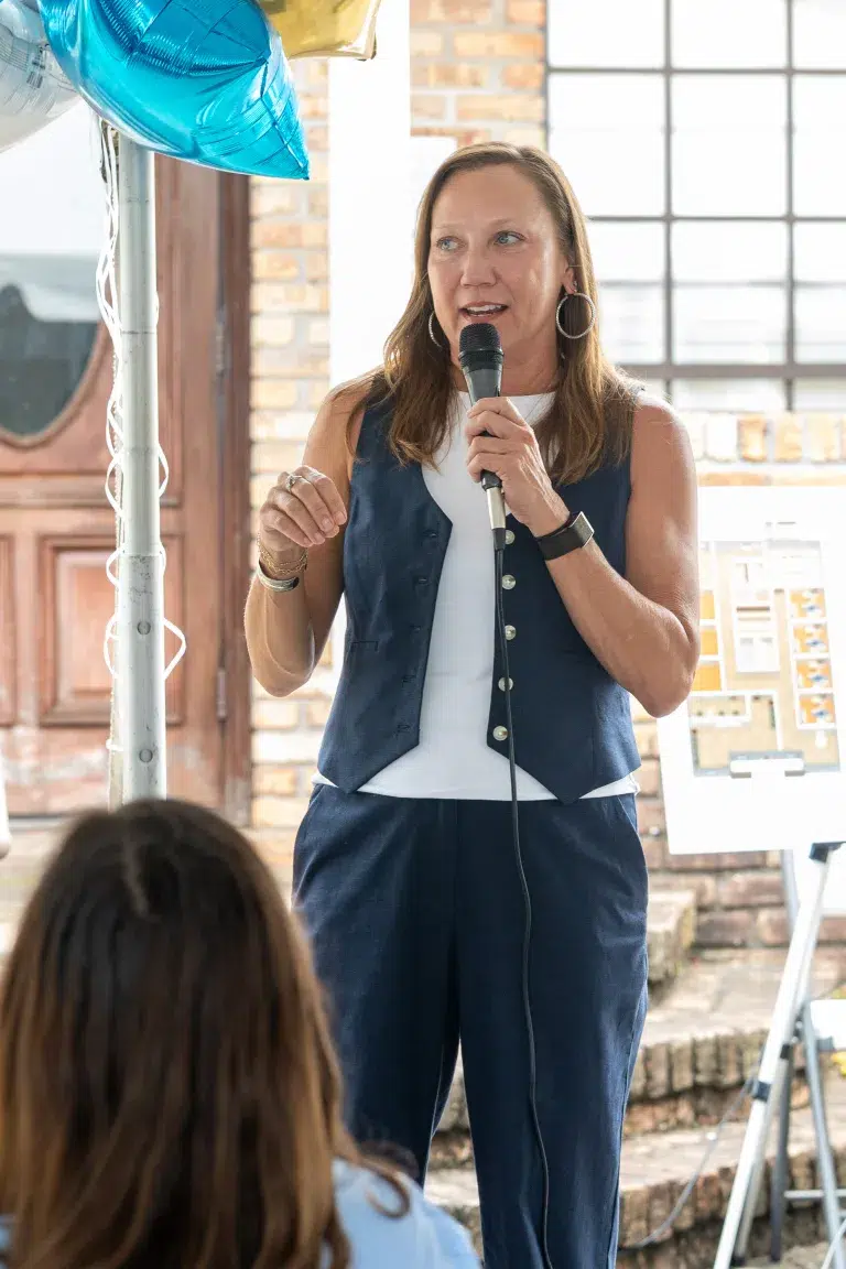 Community Health Northwest Florida CEO Chandra Smiley speaks at the Avery Street event.