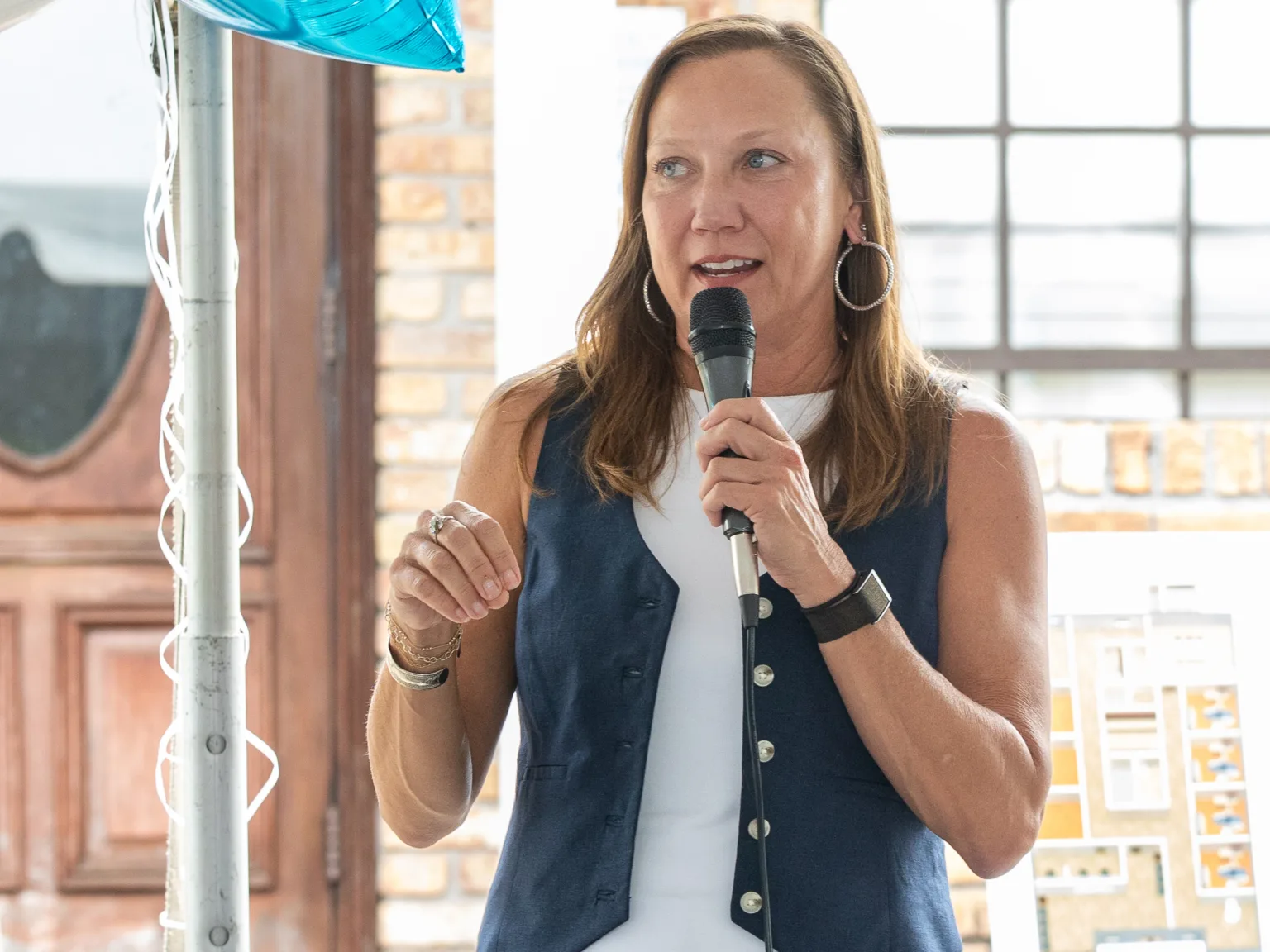 Community Health Northwest Florida CEO Chandra Smiley speaks at the Avery Street event.