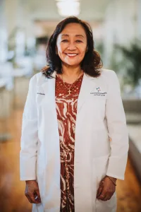 A professionally shot portrait of Letty Javier of Community Health Northwest Florida.
