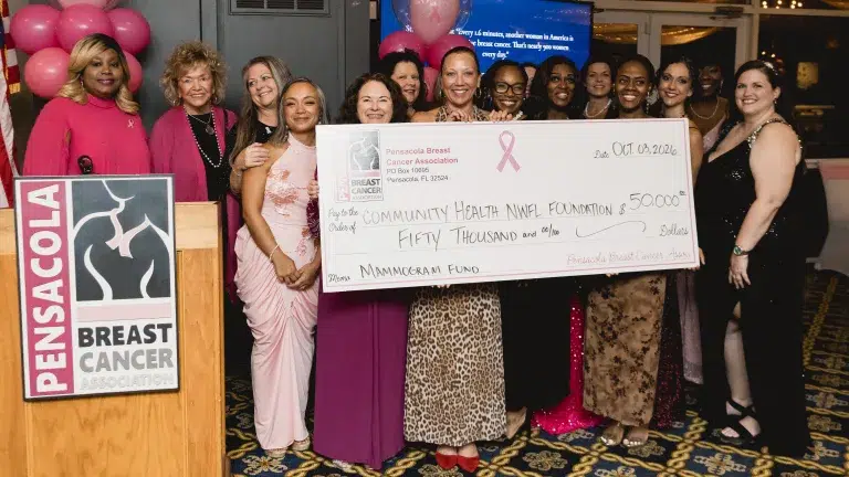 The Pensacola Breast Cancer Association presents Community Health Northwest Florida with a symbolic $50,000 check.